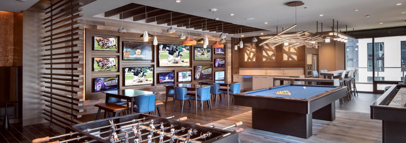 Signature : Relax and kick back in clubroom with HDTV sports wall, kitchen, billiards, shuffleboard, and foosball