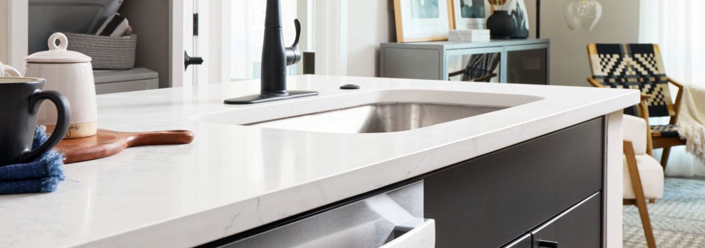 Oakville : Sleek white quartz countertops adorn each kitchen.	