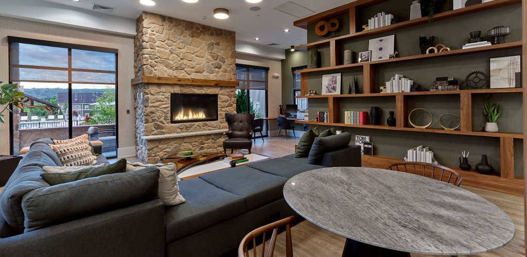 Lounge with couches and fireplace 	